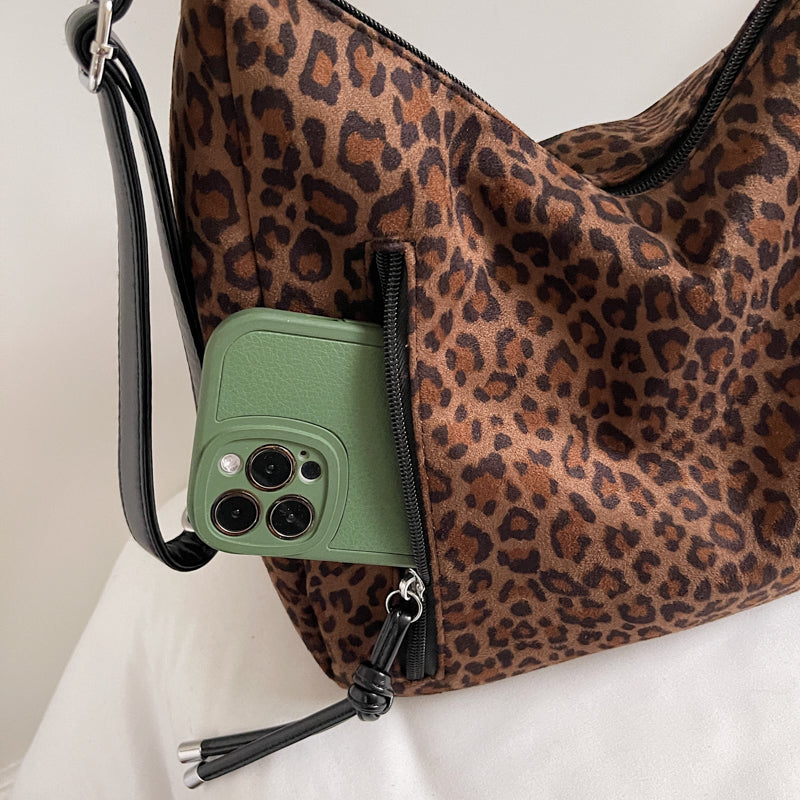 Suede tote bags, shoulder bags, and backpacks.